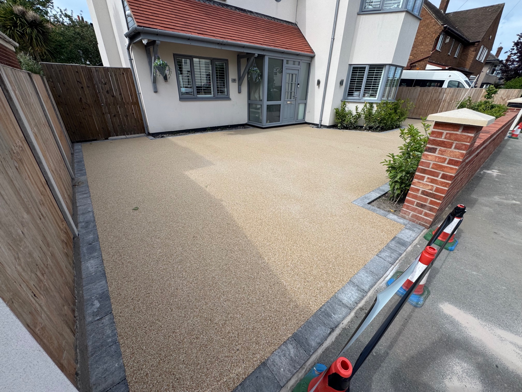 Golden resin bound driveway with block paving border